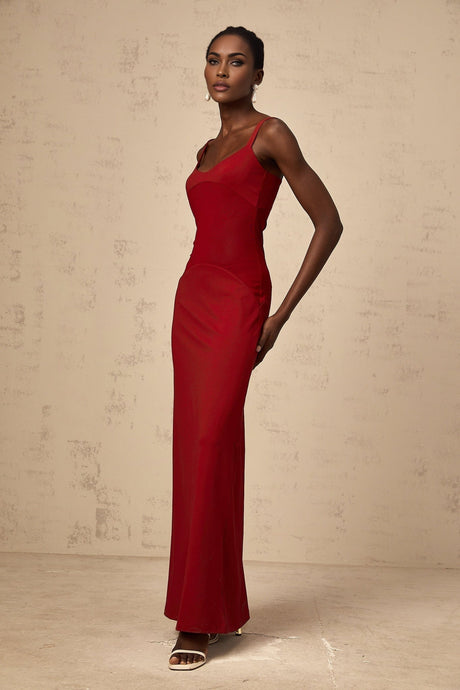 A long red maxi dress with sheer tulle panels designed by Celine