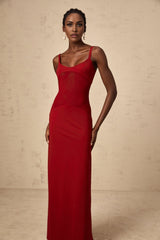 A long red maxi dress with sheer tulle panels designed by Celine