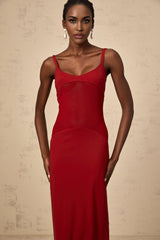 A long red maxi dress with sheer tulle panels designed by Celine