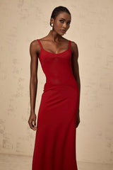 A long red maxi dress with sheer tulle panels designed by Celine