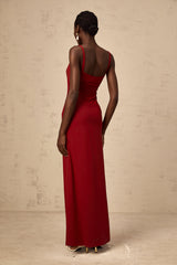 A long red maxi dress with sheer tulle panels designed by Celine