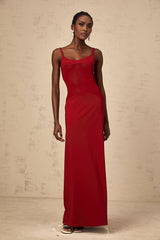 A long red maxi dress with sheer tulle panels designed by Celine