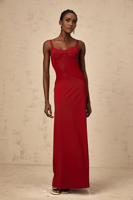 A long red maxi dress with sheer tulle panels designed by Celine