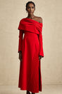A long red pleated maxi dress with a high slit for Valentines Day featuring a flowy design and romantic style