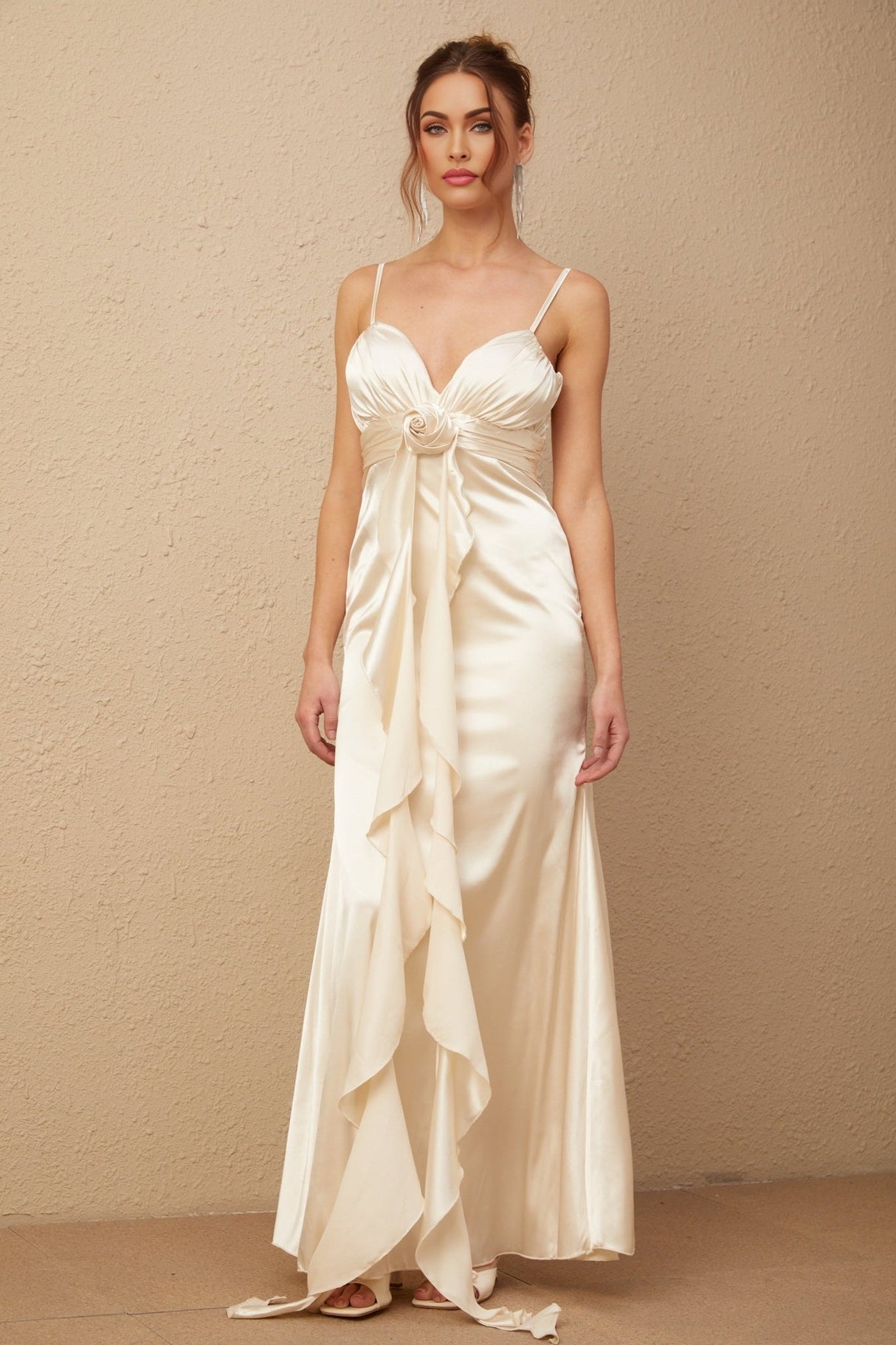 A long satin maxi dress with a corset bodice featuring floral applique details and a floral pattern throughout the fabric