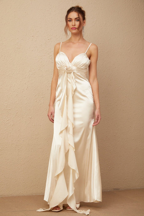 A long satin maxi dress with a corset bodice featuring floral applique details and a floral pattern throughout the fabric