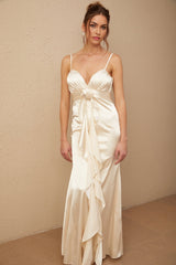 A long satin maxi dress with a corset bodice featuring floral applique details and a flowing skirt in a feminine silhouette