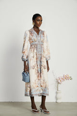 A long sleeve boho style dress with a floral print pattern called Camille