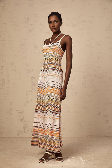 A long striped maxi dress in multiple colors featuring a knit texture by Chloe