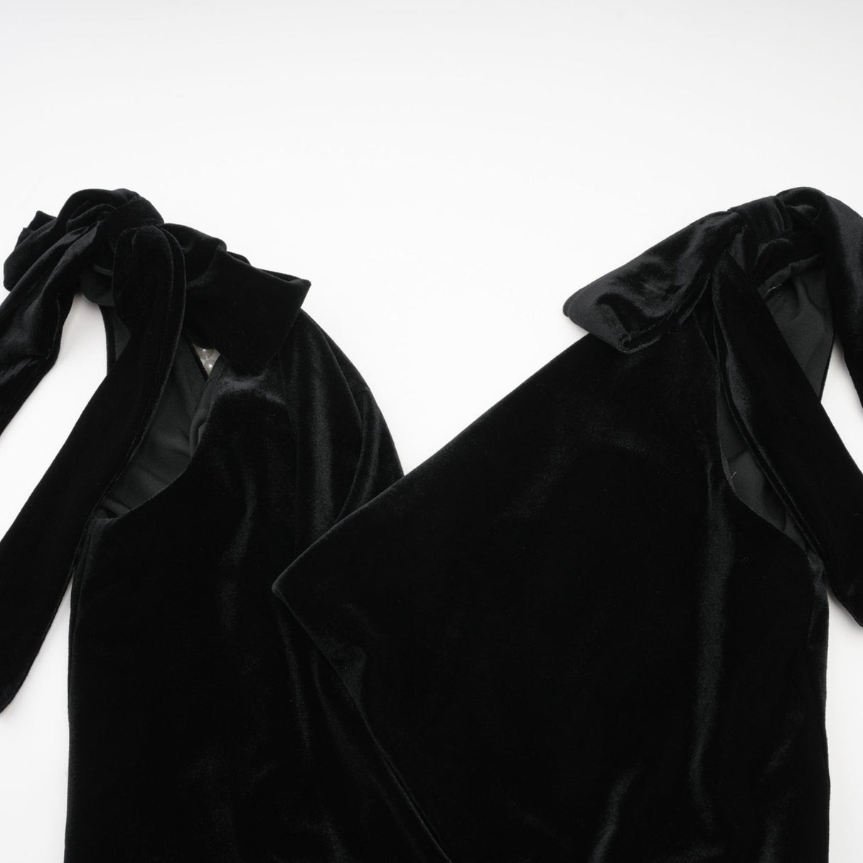 A long velvet maxi dress in dark color with an open back and embellished details named Audrey