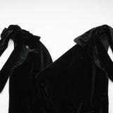 A long velvet maxi dress in dark color with an open back and embellished details named Audrey