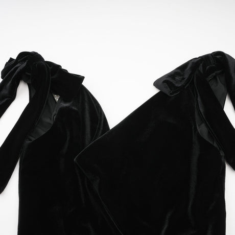 A long velvet maxi dress in dark color with an open back and embellished details named Audrey