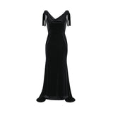 A long velvet maxi dress in dark color with embellishments and an open back design named Audrey