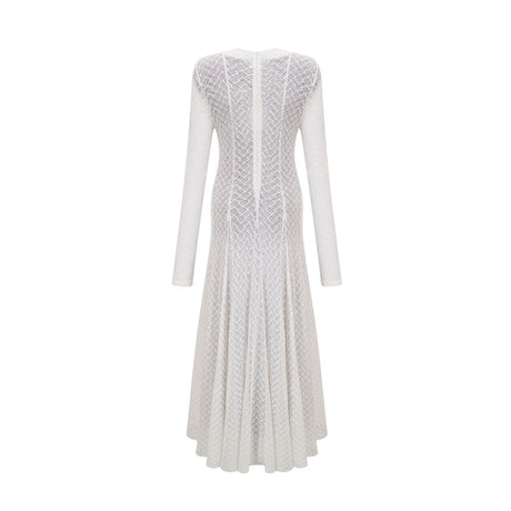 A long white lace maxi dress with a wavy pattern design featuring a feminine silhouette and delicate details