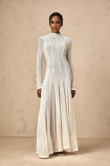 A long white lace maxi dress with a wavy pattern design named Athena