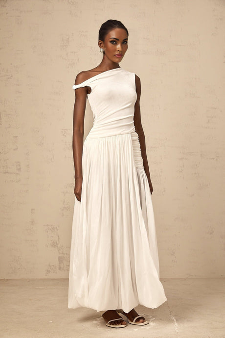 A long white maxi dress with a single shoulder strap and shirred panel detailing featuring a sleek silhouette and elegant design