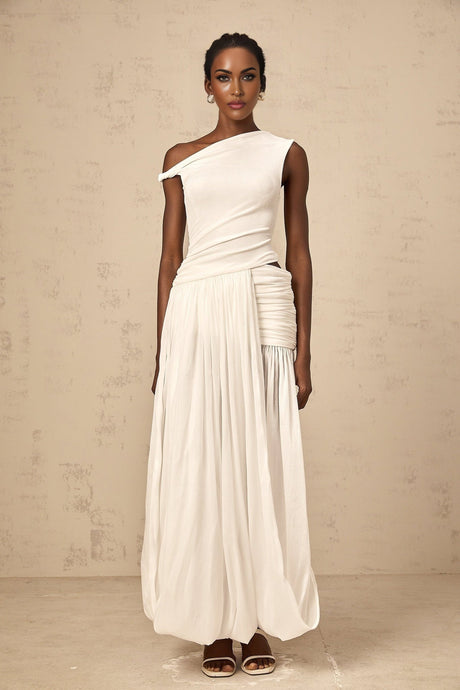 A long white maxi dress with a single shoulder strap and shirred panel detailing on the bodice featuring a fitted waist and flowing skirt