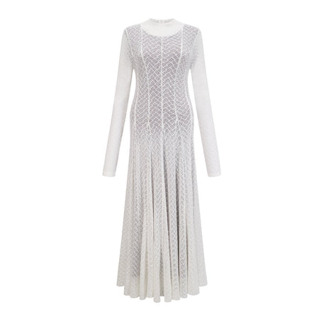 A long white maxi dress with a wavy lace pattern featuring a fitted bodice and flowing skirt
