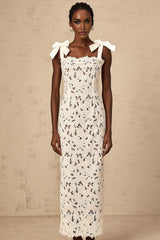 A long white maxi dress with colorful floral embroidery design named Eloise