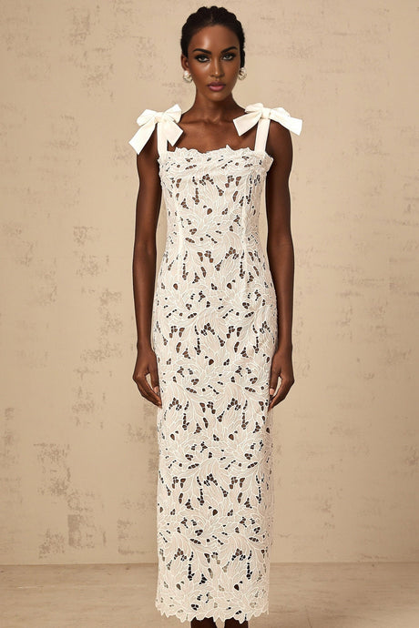 A long white maxi dress with colorful floral embroidery design named Eloise