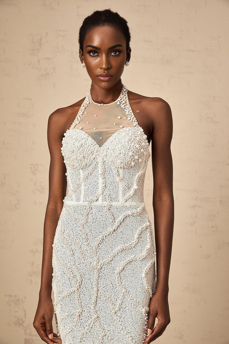 A long white maxi dress with faux pearl embellishments named Sophie