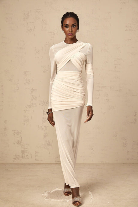 A long white maxi dress with ruched tulle detailing and a flowing silhouette named Veronique