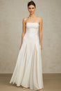 A long white maxi dress with tulle panelling named Nathalie featuring a flowy silhouette and delicate sheer details