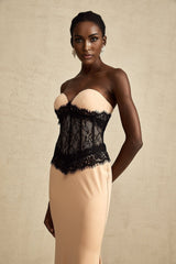 A long white offshoulder maxi dress with a corset bodice featuring delicate lace panels and a flowing skirt