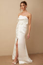 A long white satin maxi dress with floral applique details named Anna
