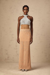 A long white semisheer maxi dress with faux pearl embellishments adorning the fabric named Rosa