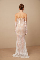A long white tulle maxi dress with a corset bodice featuring colorful floral embroidery and a flowing skirt