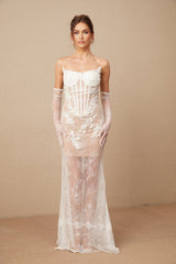A long white tulle maxi dress with a corset bodice featuring colorful floral embroidery and delicate straps