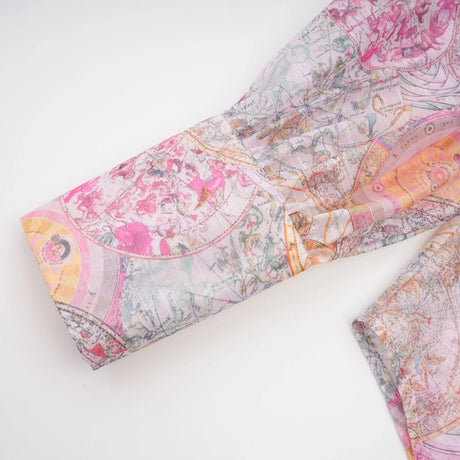 A matching set consisting of a cherry pink shirt and skirt both featuring a pattern print design