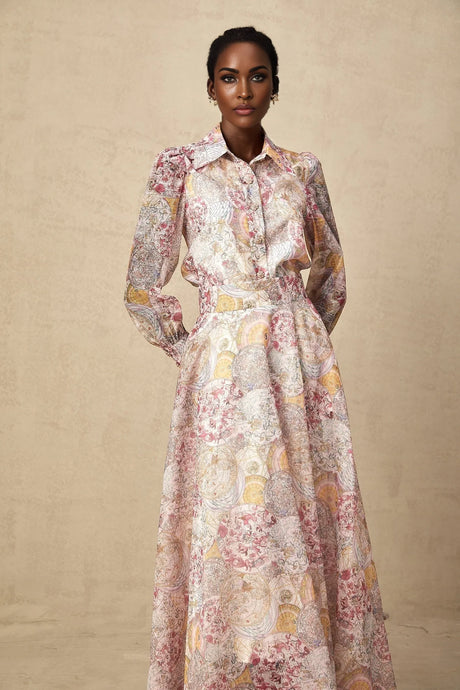 A matching set consisting of a cherry pink shirt and skirt both featuring a printed pattern design