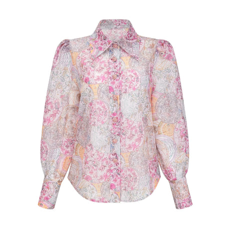 A matching set consisting of a cherry pink shirt and skirt with a pattern print design The shirt and skirt are displayed together showcasing the coordinated outfit