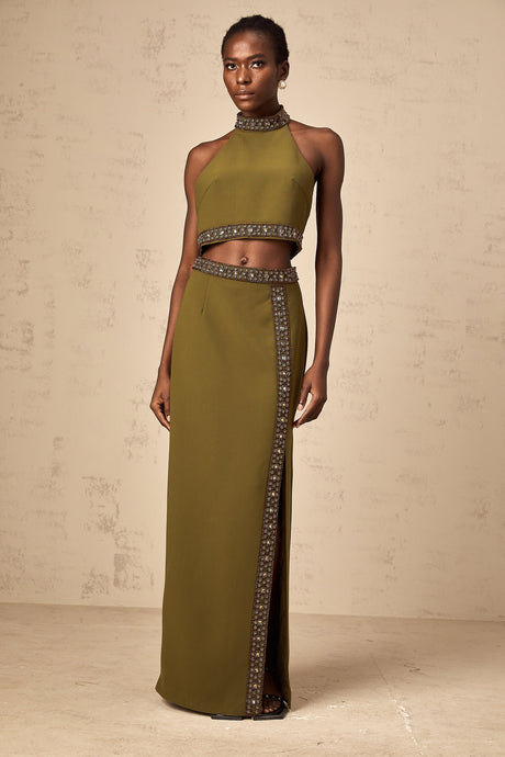 A matching set consisting of a green top and skirt with daisy beaded trim details The top and skirt have a light green color and feature decorative daisyshaped beads along the edges