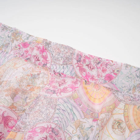 A matching set consisting of a shirt and skirt in cherry pink color with a pattern print design