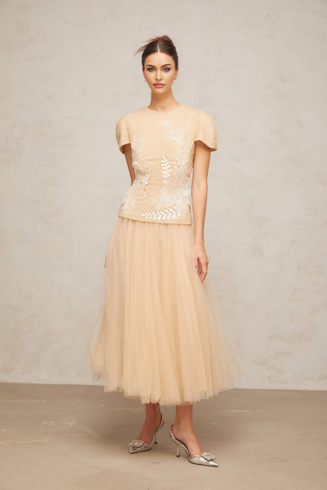 A matching set consisting of a white tulle top and skirt decorated with colorful floral appliques named Ludivine