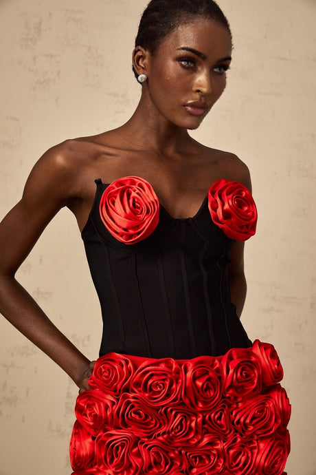A matching set featuring a red top and skirt with rose appliques named Heloise