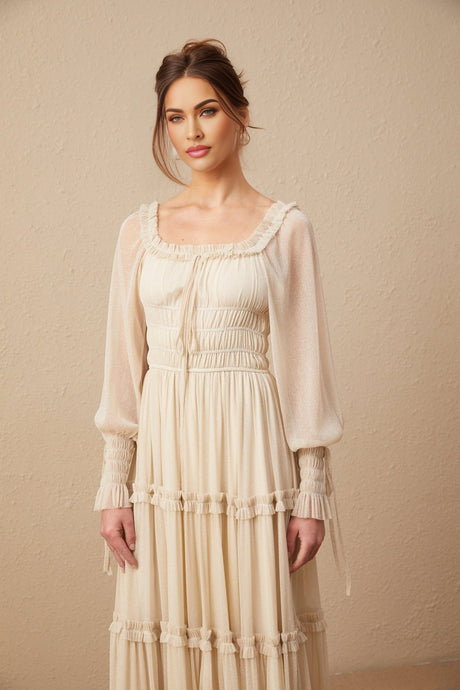 A metallic midi dress with pleats and shirred details named Camille featuring a flowy silhouette and shimmering fabric