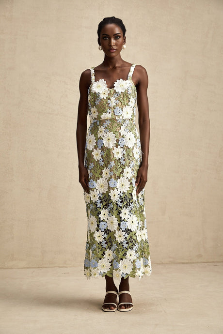 A midi dress with floral embroidery and hollowcarved details named Carla featuring a delicate pattern and feminine silhouette