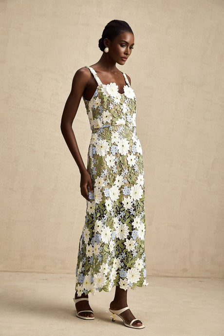 A midi dress with floral embroidery and hollowcarved details named Carla featuring a delicate pattern and intricate cutout design