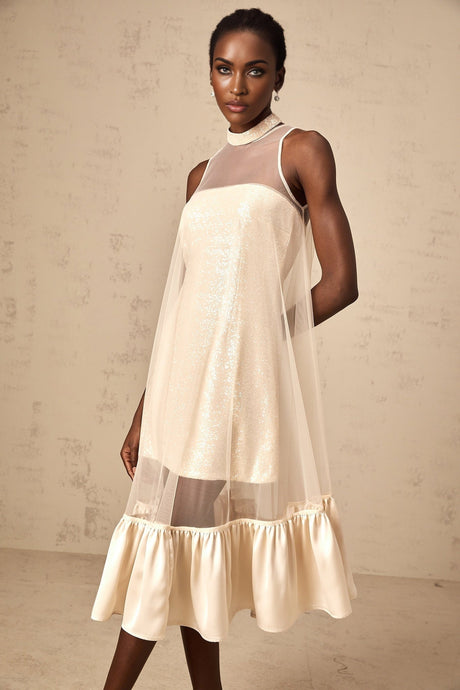 A midi length dress with sequin embellishments and tulle overlay featuring a layered skirt design named Josette