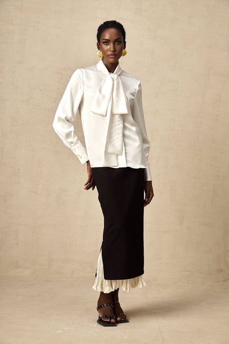 A midi skirt with color blocked panels featuring the name Heloise