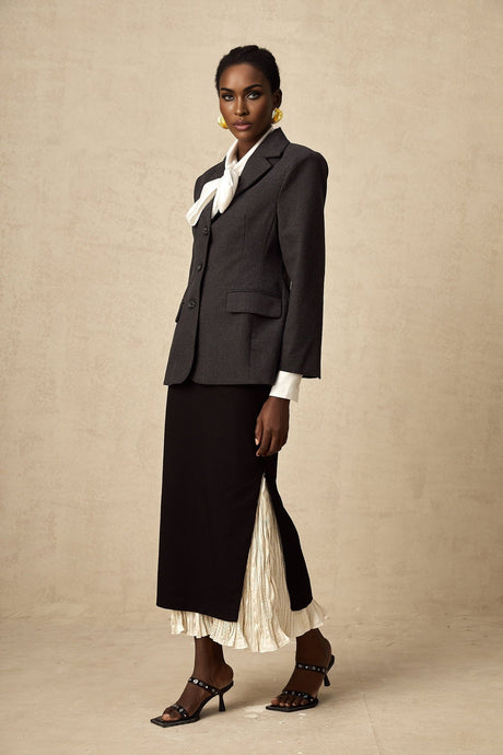 A midi skirt with colorblocked panels featuring a combination of different colors and patterns in a modern design named Heloise