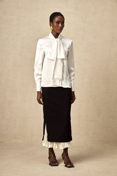 A midi skirt with colorblocked panels featuring the name Heloise