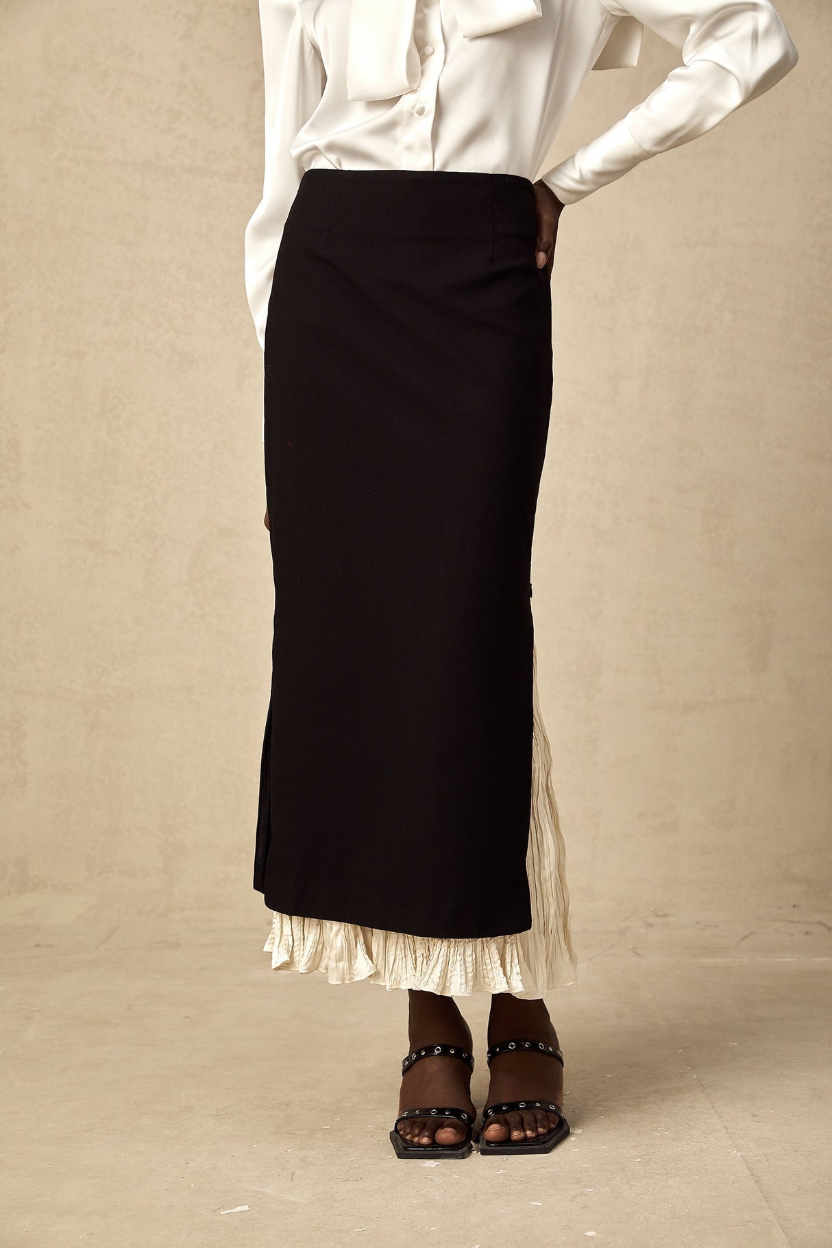 A midi skirt with colorblocked panels in different shades featuring a panelled design and falling to mid calf length