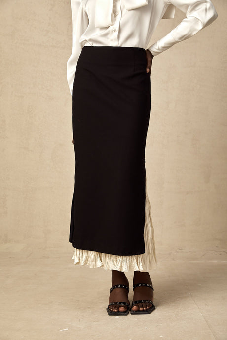 A midi skirt with colorblocked panels in different shades featuring a panelled design and falling to mid calf length