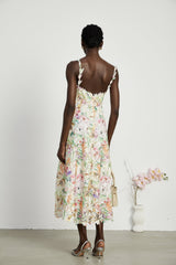 A midlength lace dress with floral embroidery called Enora featuring delicate details and feminine design