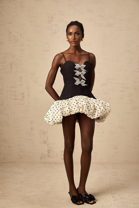 A mini dress with color blocking featuring a bowknot detail and polka dot pattern named Berengere